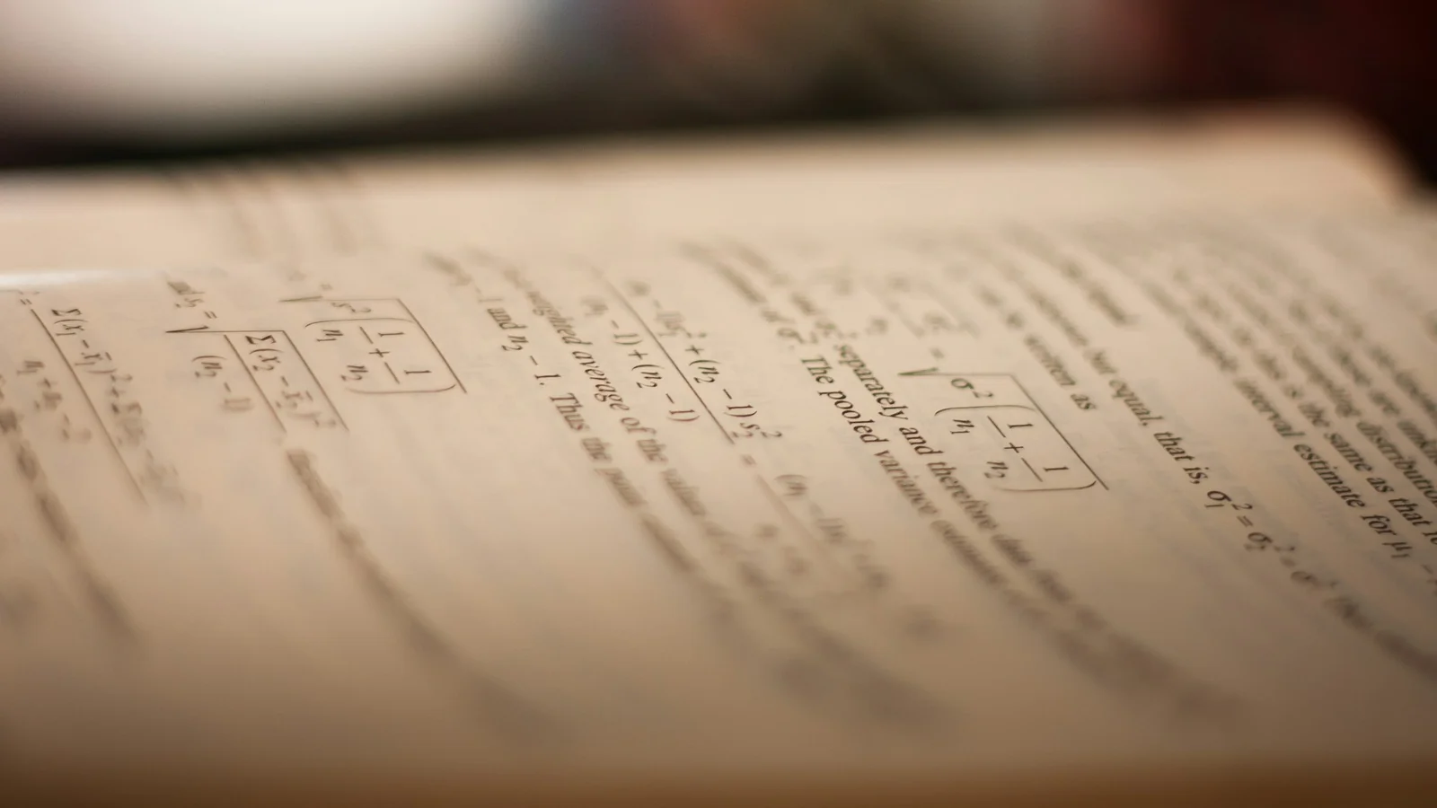 A close-up of a piece of notebook paper with mathematical practice problems
